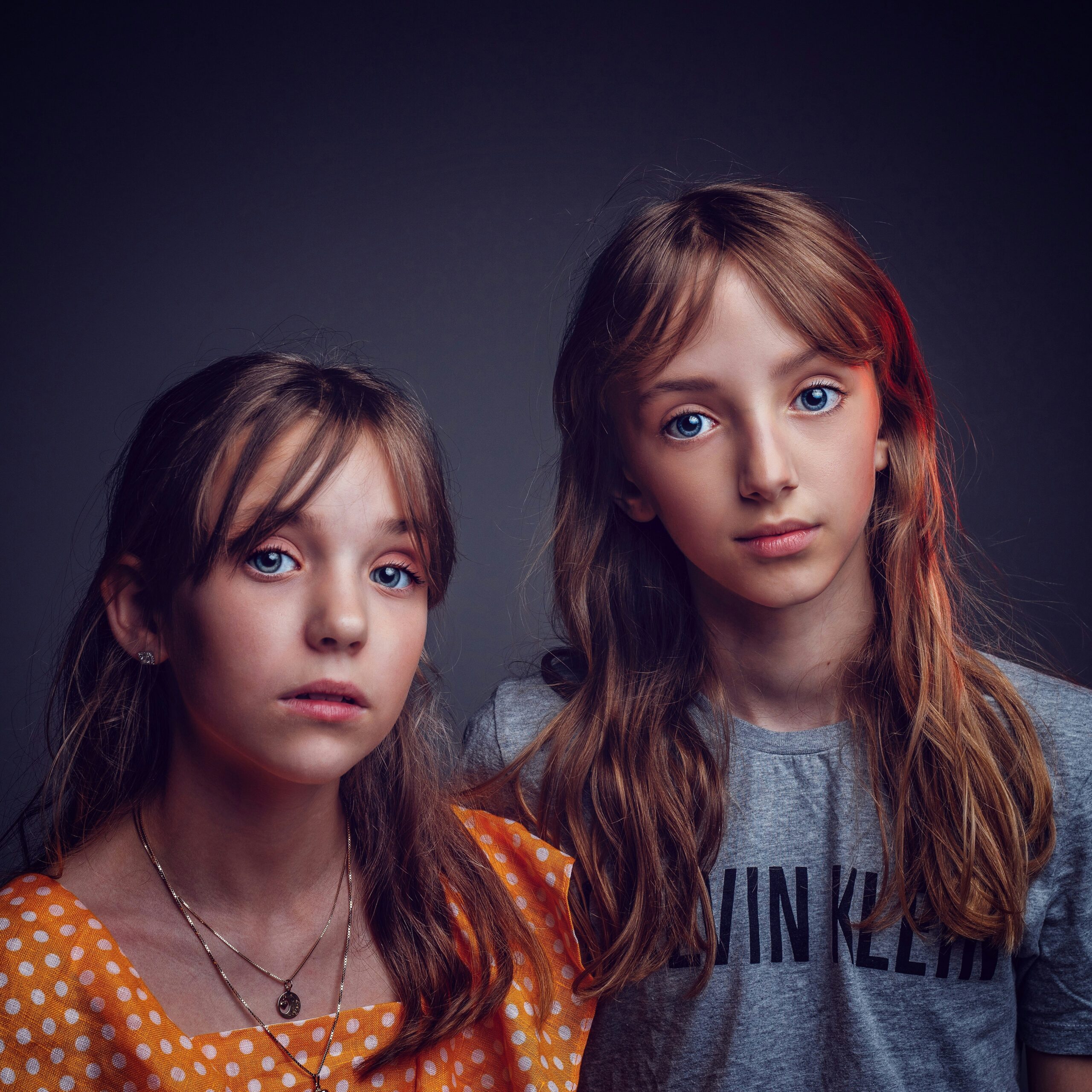 two girls in shirts two girls in shirts posing for photo